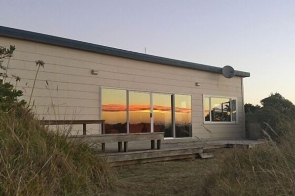 Sun setting on the beach house