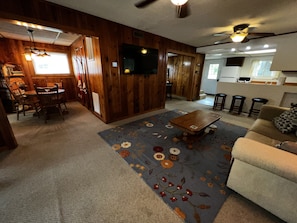 Family Room - Large TV, 2 ceiling fans.