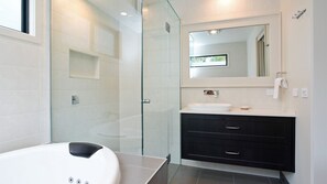 Large shower with rain head, and deep double spa in your ensuite.