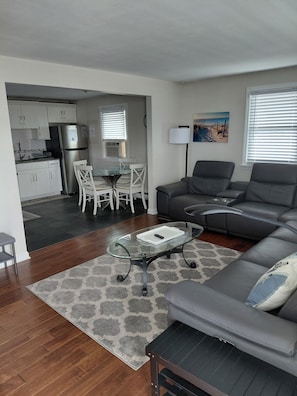 View of living room/kitchen from front door