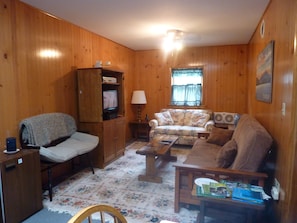 Family room, includes Dish TV, and a fold-down futon.