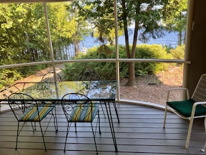 Dining in the screen porch facing the water