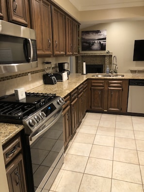 New appliances and plenty of counter space in kitchen.