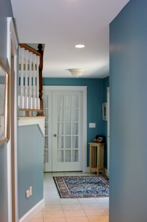 View of 1st floor hallway looking toward front entrance.