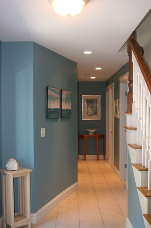 View of 1st floor hallway looking toward bedrooms and full bath.