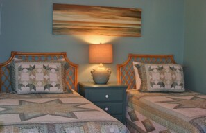 1st floor Twin Bedroom. Soothing pale green walls with neutral tile floors.