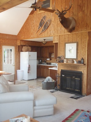 Open floor plan with wood burning fireplace