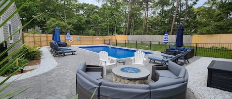 After a day at the beach and dip in the pool, relax around a gas fire pit