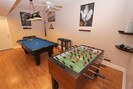 Game room with pool and foosball tables, 42 inch TV, XBox
