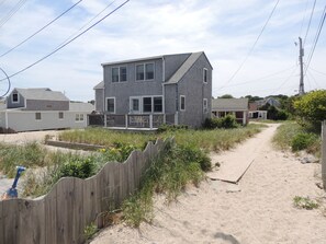 A view of the house from the staircase to down to the beach

