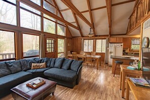 Second floor living room looking into dining area and kitchen