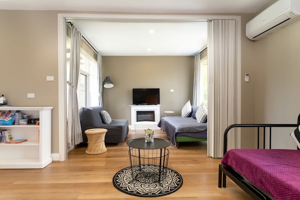 Living/Sleeping Areas. Retractable door serves as a fourth room. 