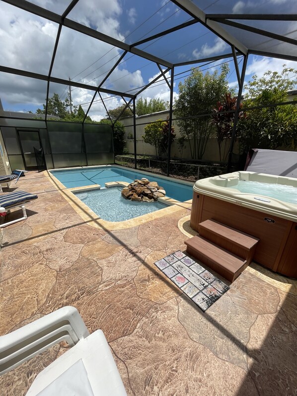 Pool with beautiful waterfall , toddler pool & hot tub (free hot tub heat)