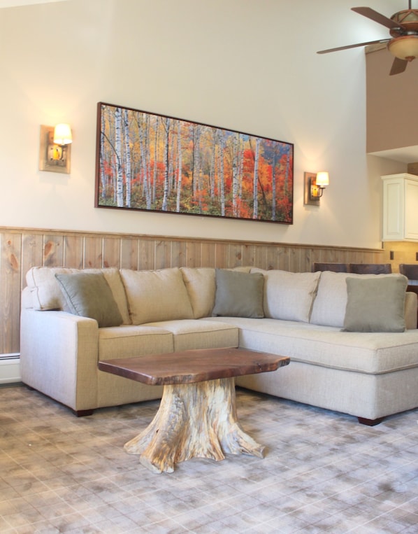 Living Room-With Wood Burning Fireplace and views of Villager Lift and mountain.