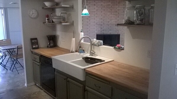 Large Farmhouse Sink & dishwasher in kitchen, micro, toaster, coffee maker, etc