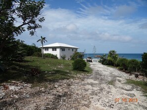 View of back of the house, from the driveway leading into the property