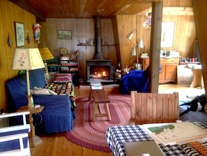 Longer shot of the living room, with woodstove for chilly nights