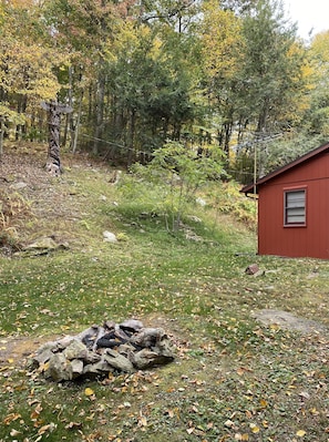 Firepit on side of cabin