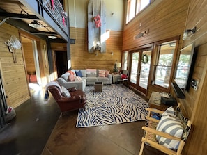 Living area, faces the lake view; vintage 1940’s skimmer on display