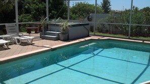 Spa, pool, side fence, another sun, 2 of 4 loungers,another table outside lanai