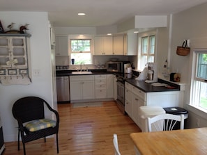 view of kitchen with new appliances, cabinets, and countertops