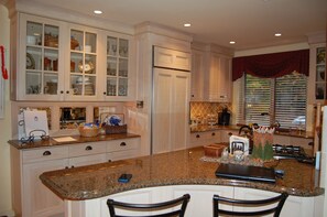 Granite counters and custom cabinetry,  microwave and Keurig coffee machine