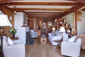 Upper unit living room with ample seating arrangements.
