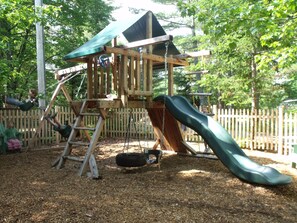 Children will love the quality play structure and enclosed play area.