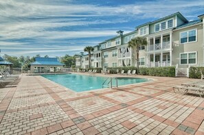 Over-sized community pool steps from house.