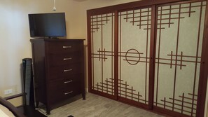 Master bedroom full size dresser and flat screen TV