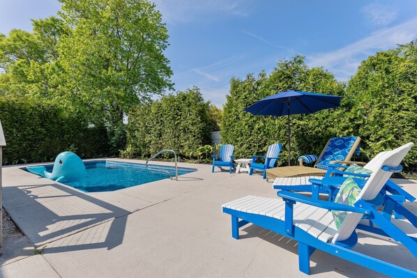 In Ground pool.  This yard is your own Oasis.  The Pool is heated and open from April till November. The Trees keep this yard very private.   