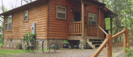 Cabin borders park. Glass doors open to pourch ovrlkg creek, see/hear from bed