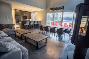 A large kitchen/living/dining area with fireplace makes a cozy hangout