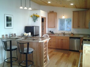 Open floor plan, plenty of sunlight, Hardwood floors throughout, Custom lighting