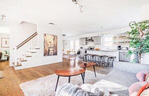 Living room with view of kitchen and dining table