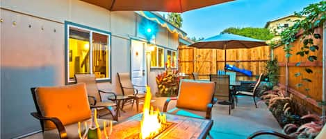 Enjoy the private outdoor patio with fire table, BBQ, and dining table.