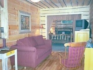 living room with bedroom beyond