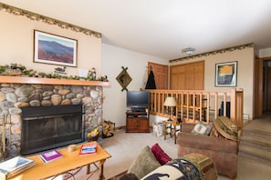 Another view of our living room, with a wood burning fireplace!