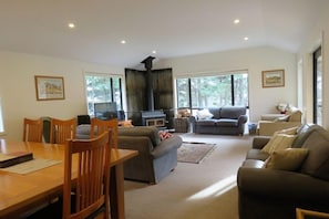 The spacious living area complete with log fire