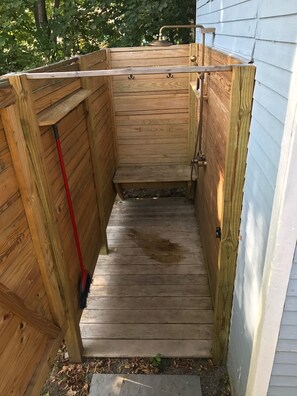 huge outdoor shower with rain head and hand held sprayer