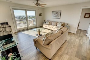 Top-Level Den with Wet Bar and Deck Access