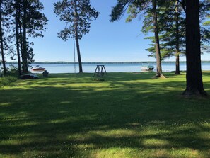 Huge 100 feet of lakefront lawn with fire pit and dock