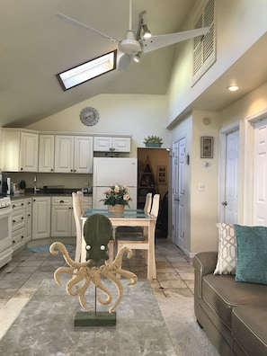Living room/Kitchen Combo is bright and cheery w/vaulted ceilings & 2 skylights.