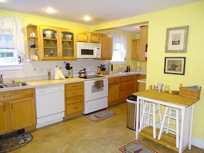 Bright kitchen with all appliances 