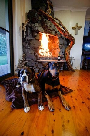 Enjoy the spectacular stone open fireplace during cooler months at dog friendly Barrington Coast holiday accommodation Sea Horse Diamond Beach