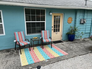 Outdoor seating adjacent to the blue cottage