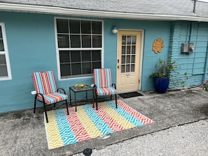 Outdoor seating adjacent to the blue cottage