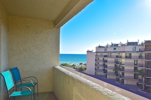 Balcony with partial gulf views accessible from LR & Primary Bdrm