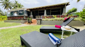 the private back area of the house looks to the beach, lagoon and island