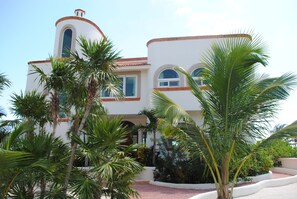 Front of Villa with Beautiful Landscaping 